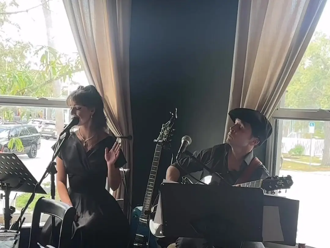 The Western Gypsies playing by the café windows on a Sunday